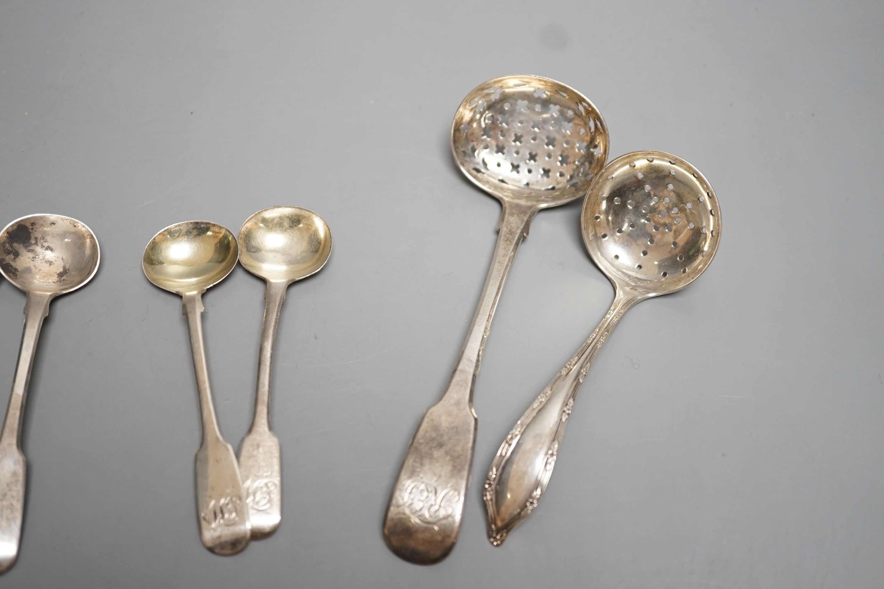 A quantity of silver teaspoons, sifter spoons and condiment spoons, including a set of six coffee spoons, London, 1899